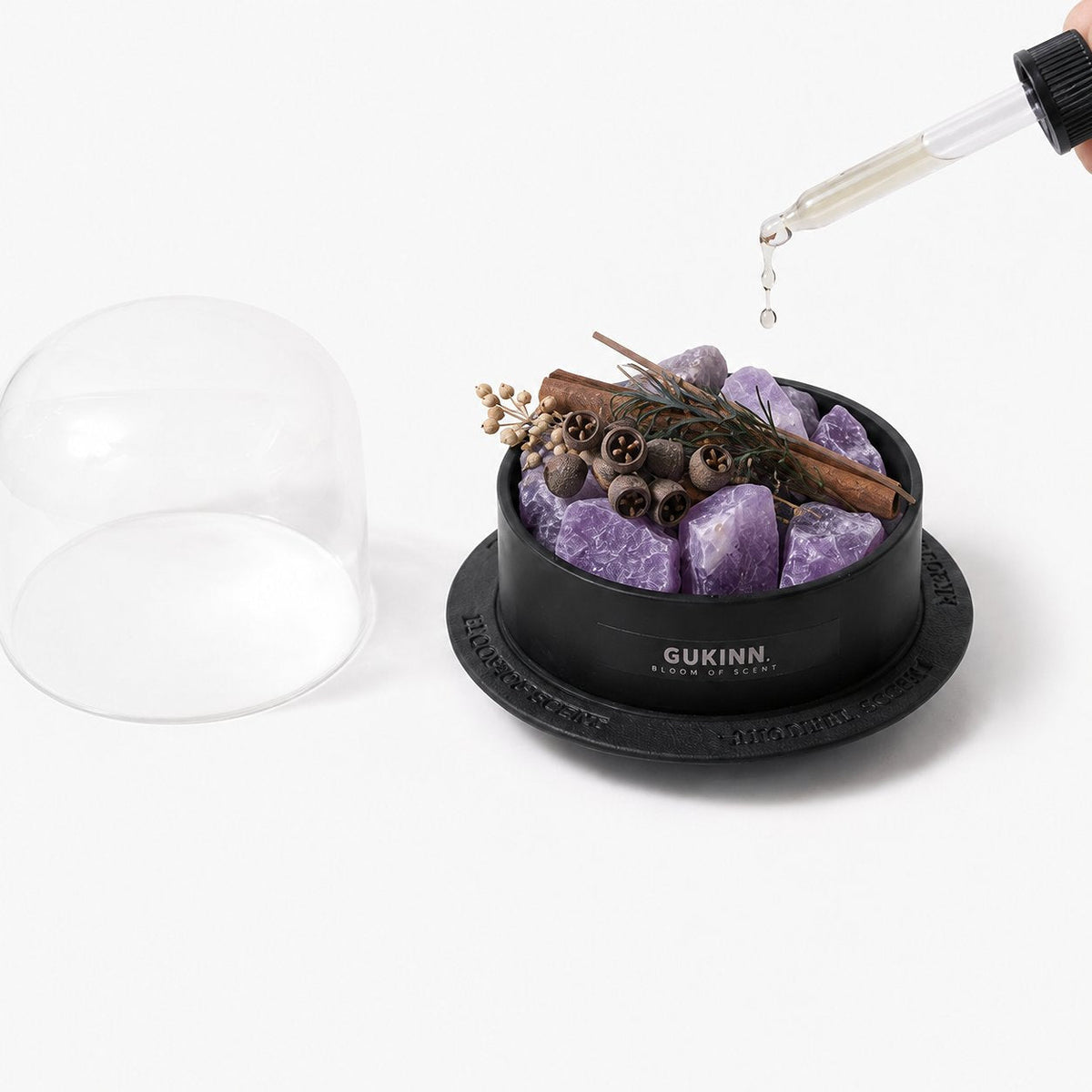 Glass aromatherapy dome with amethyst crystals
